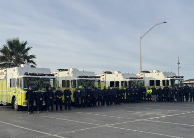 Picture of four hazmat vehicles and teams.